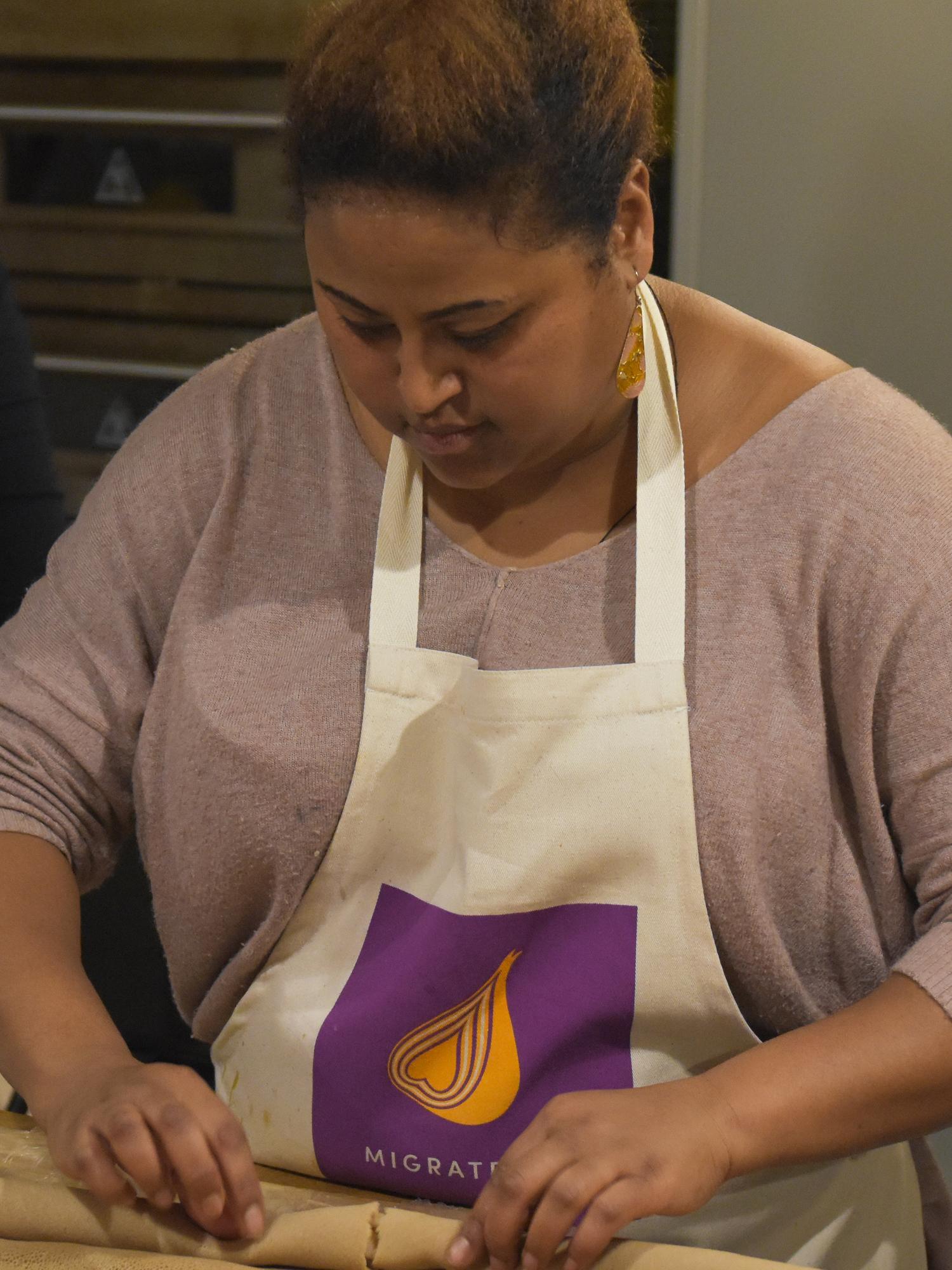 Rawa preparing her injera flatbreads, the staple of her cuisine