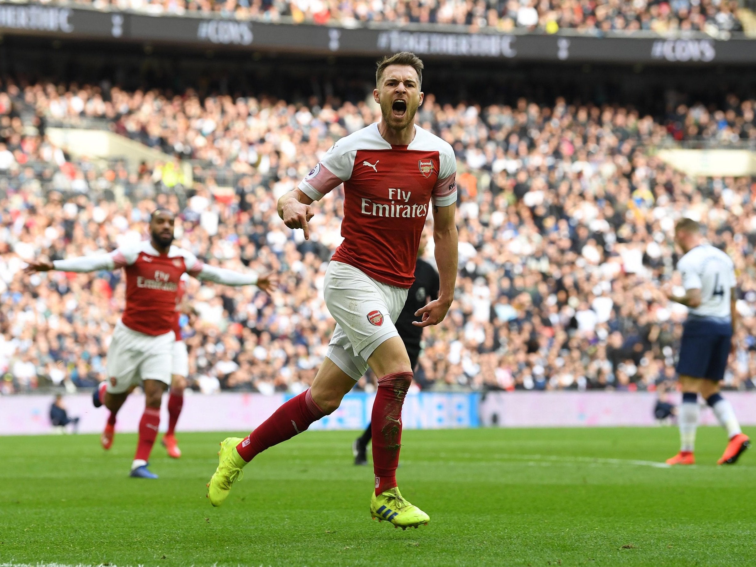 Aaron Ramsey celebrates after putting Arsenal in front against Tottenham
