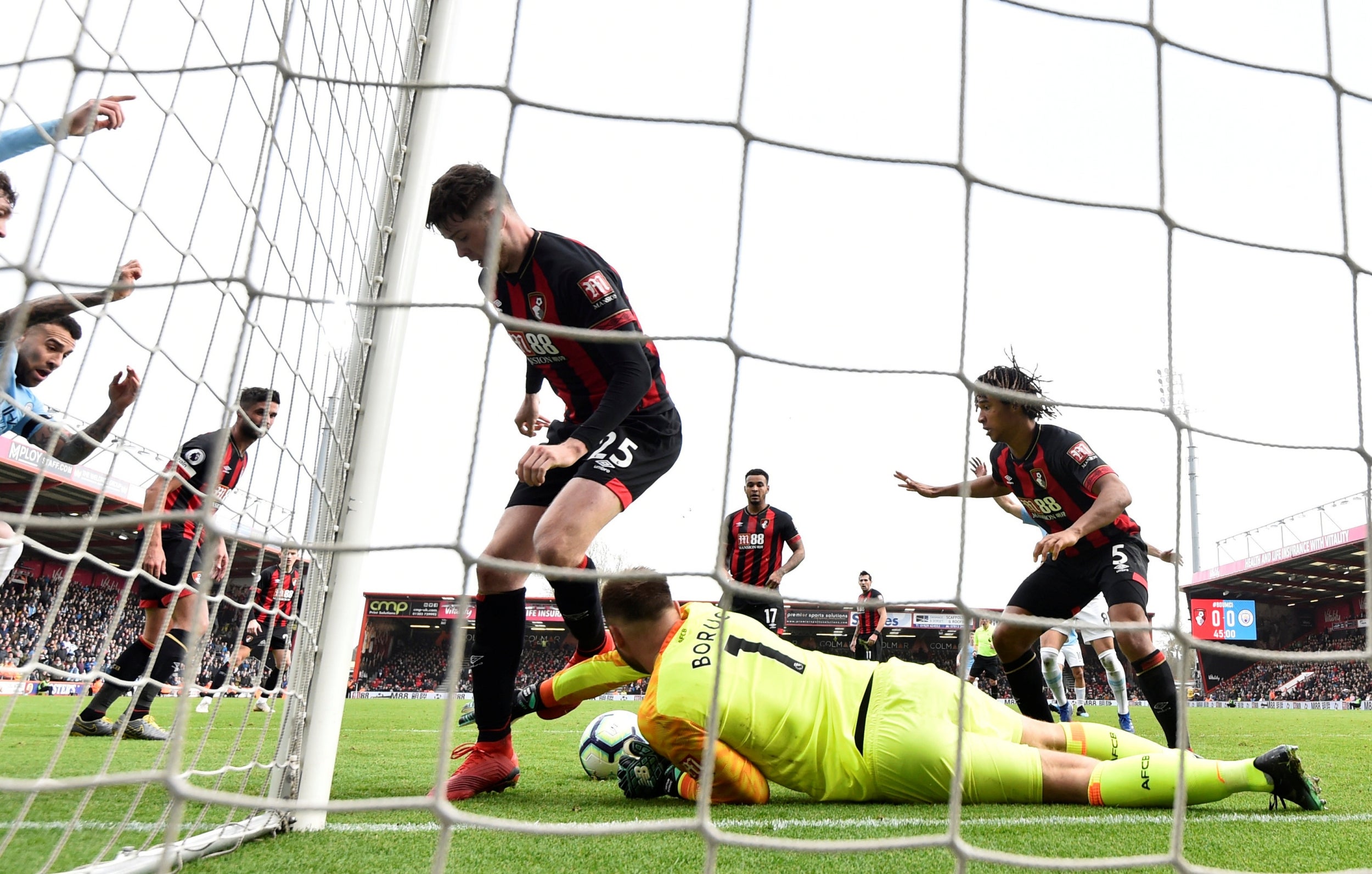 Artur Boruc denies Manchester City a goal during the first half