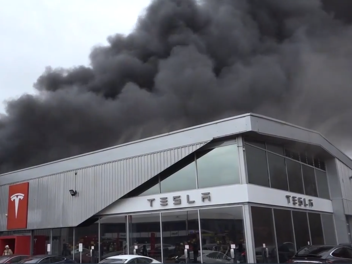 Crawley Tesla fire: Explosions reported as blaze rips through showroom ...