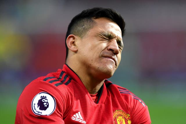 Alexis Sanchez was brought off with a knee injury in the second half