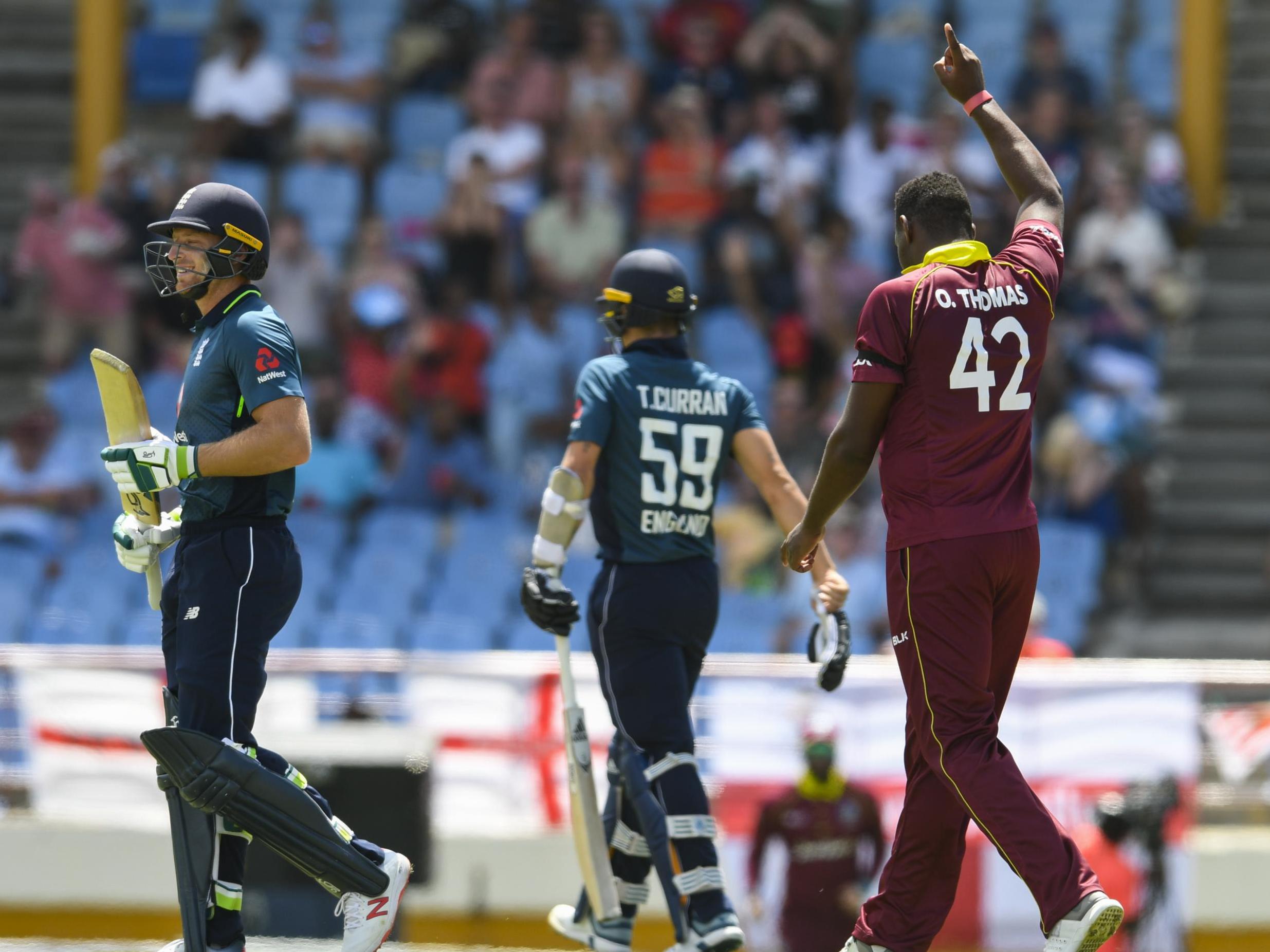 Oshane Thomas celebrates the dismissal of Jos Buttler