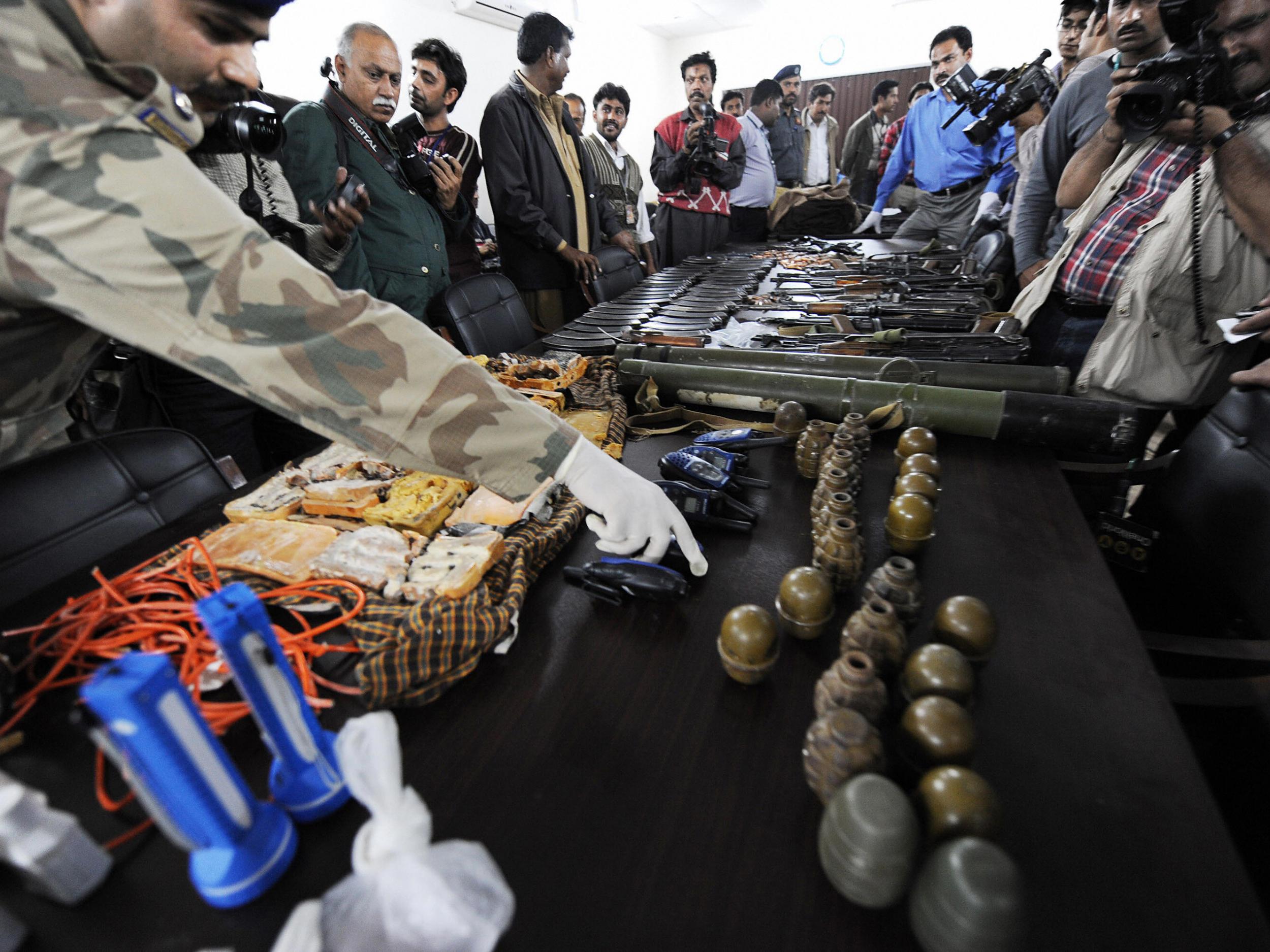 Police show some of the weapons used in the attack