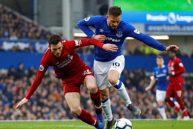 Everton's Gylfi Sigurdsson in action with Liverpool's Andrew Robertson