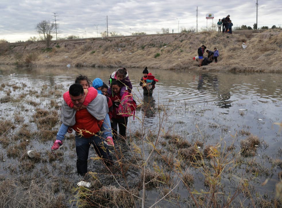 Central American immigrants cross the Rio Grande earlier this year