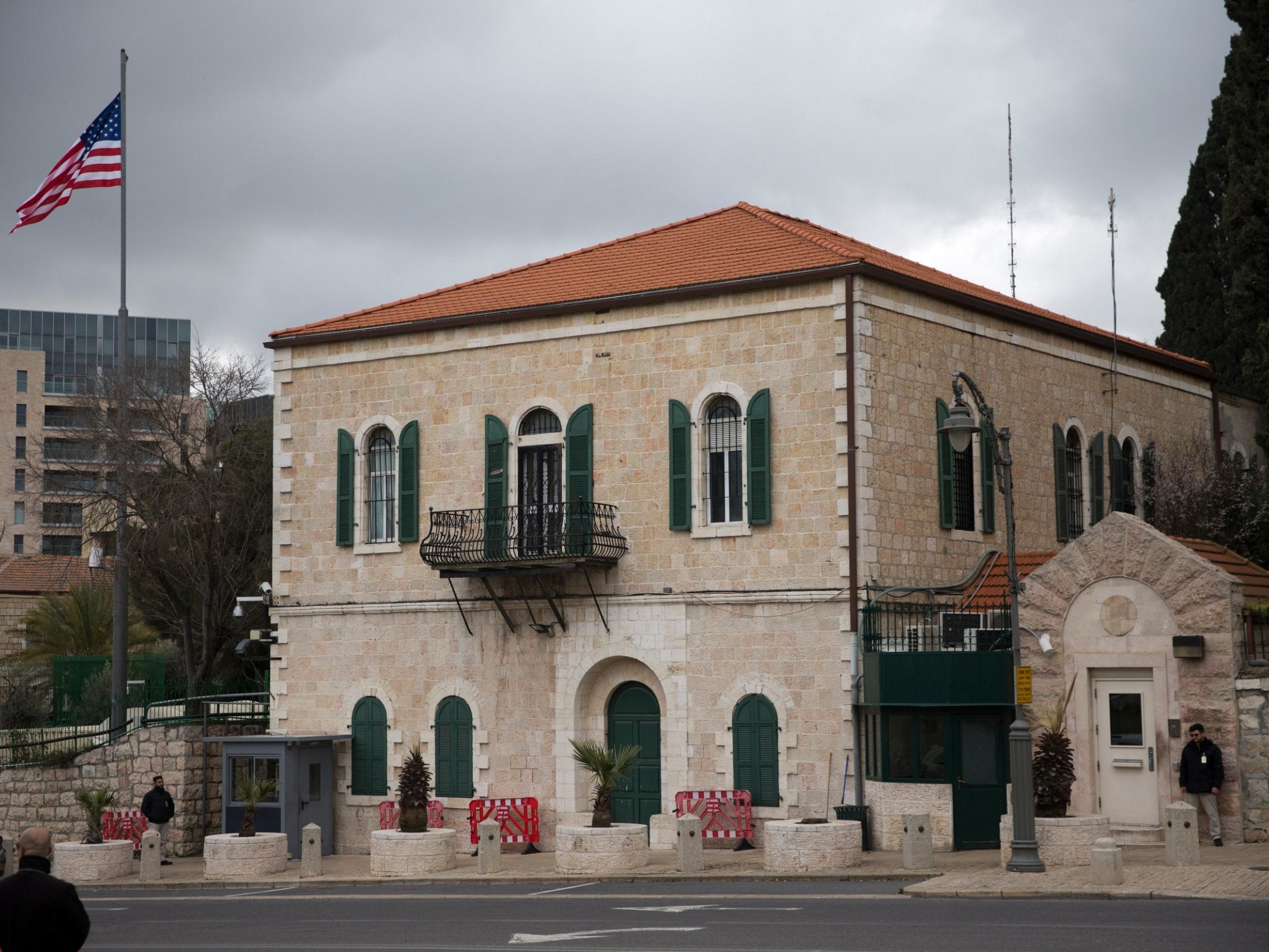 A flag flutters at the former US consulate building in Jerusalem