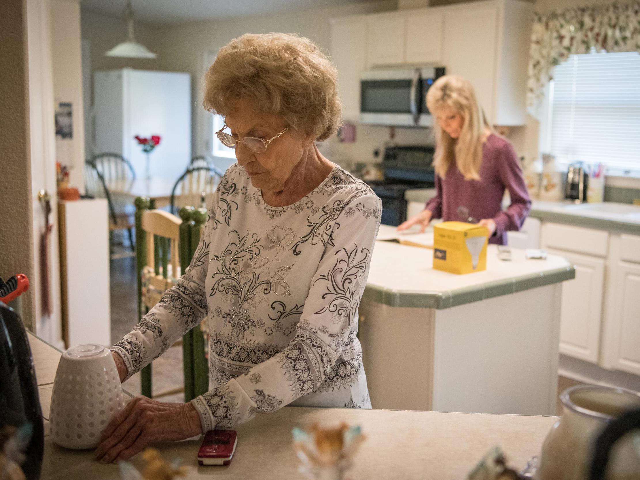 O’Connell organises her kitchen with her daughter, Elaine Dilley, who says her mother’s pain was so intense ‘you couldn’t touch her’ (Loren Elliott for The Washington Post)