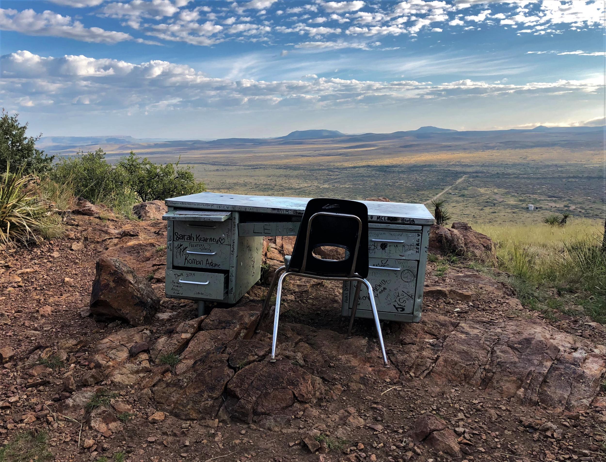 A heavy metal desk sits on a hill in Alpine