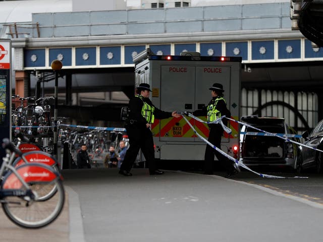 Police officers secure the scene at Waterloo