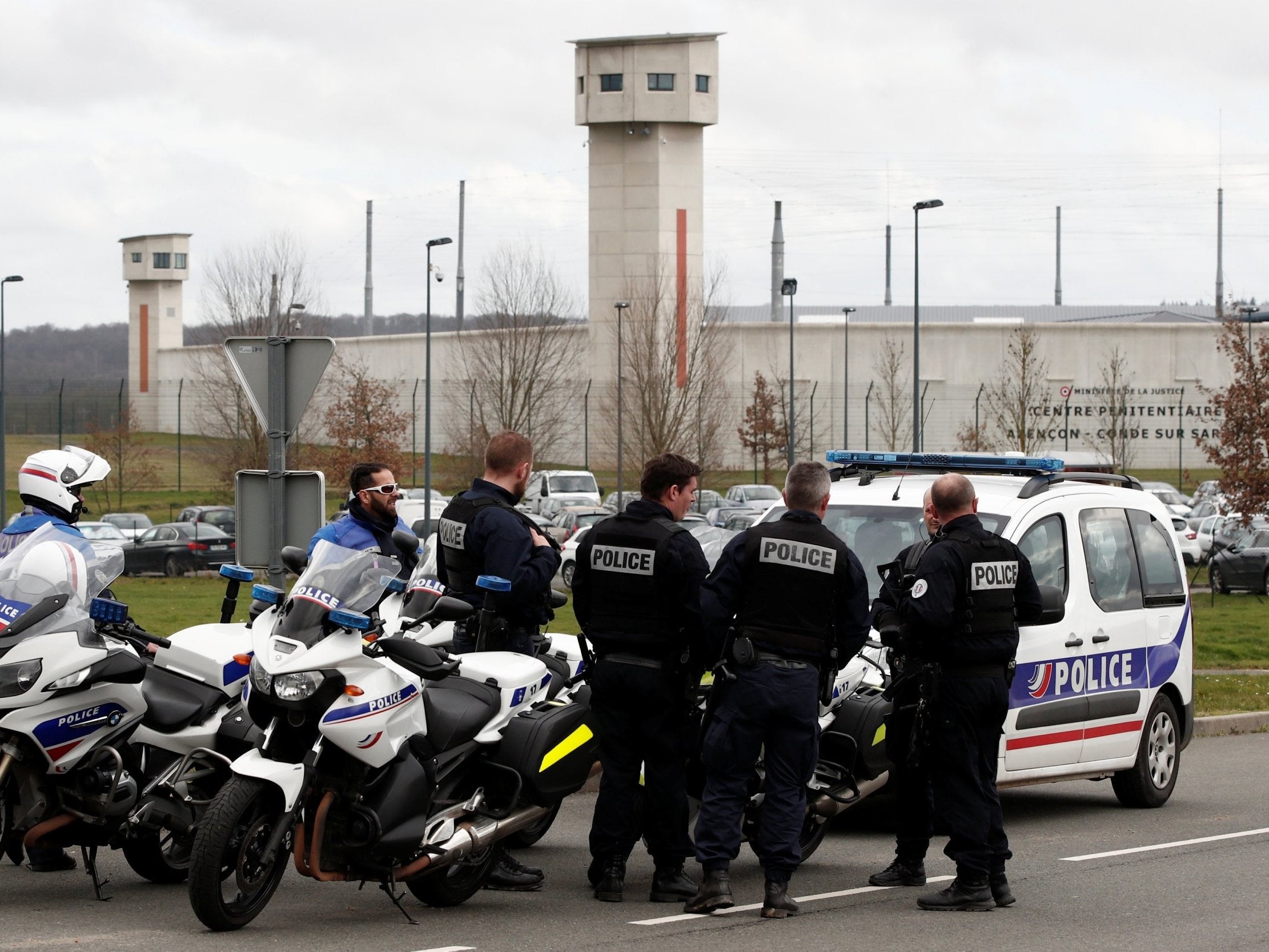 French police take position outside the prison where an inmate stabbed two guards with a knife in Conde-sur-Sarthe, France, on 5 March 2019.