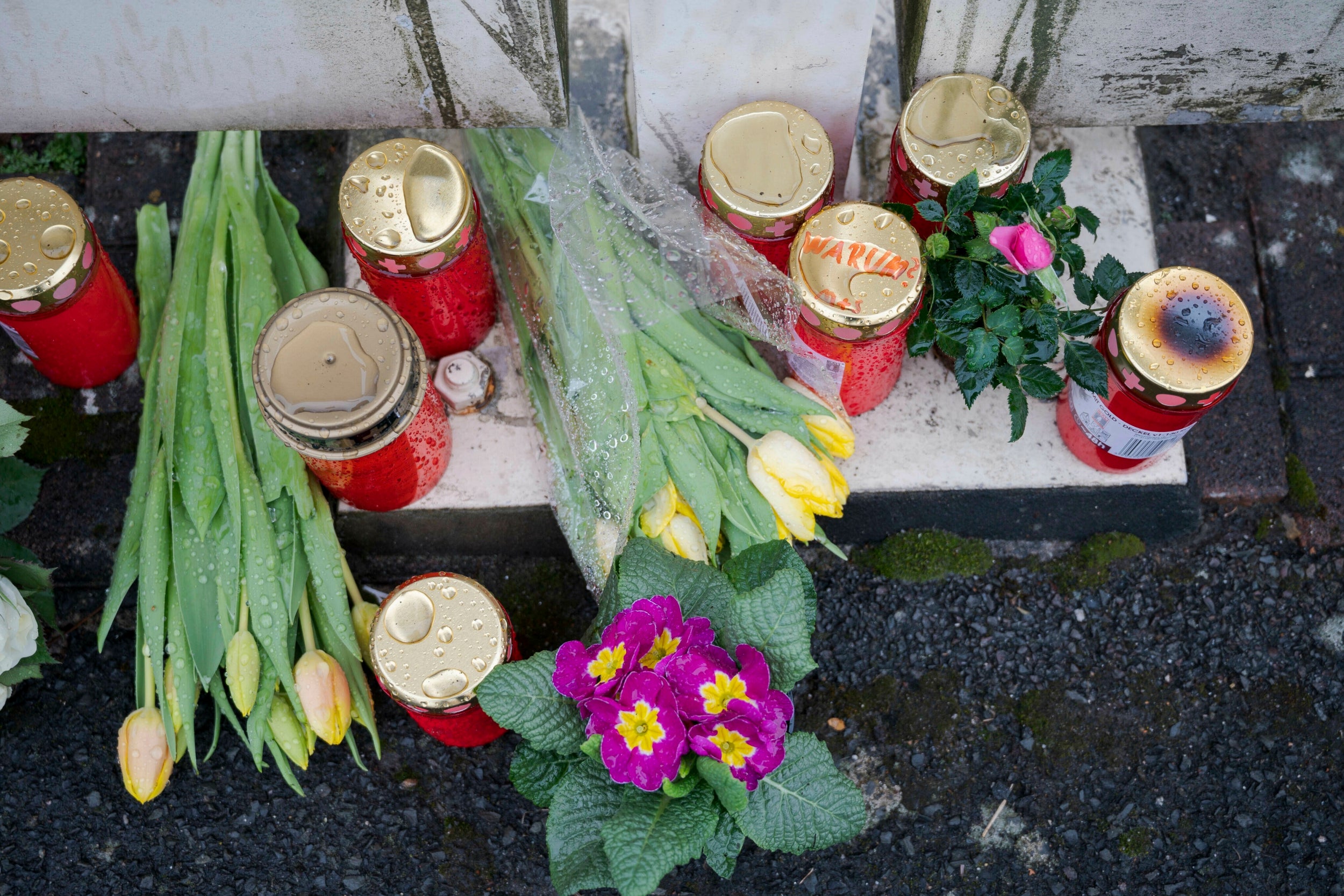 Flowers at the home of a doctor, who died in an explosion in Enkenbach-Alsenborn in Germany