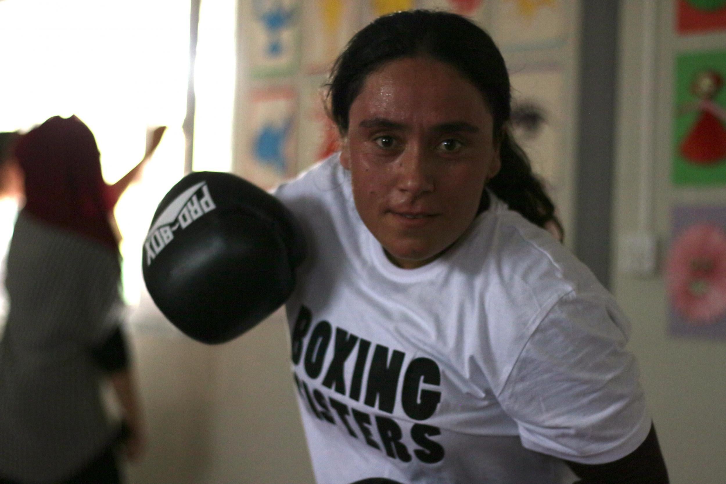 A boxing sister shows off her skills in the Rwanga camp