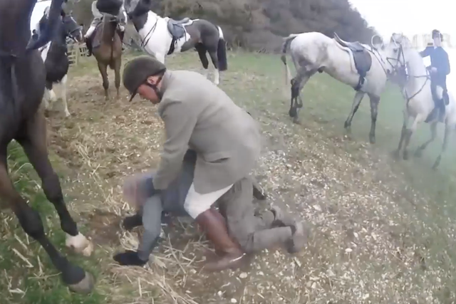A hunter from the Middleton and Derwent Hunt in Yorkshire is seen straddling a protester in a fracas in 2018