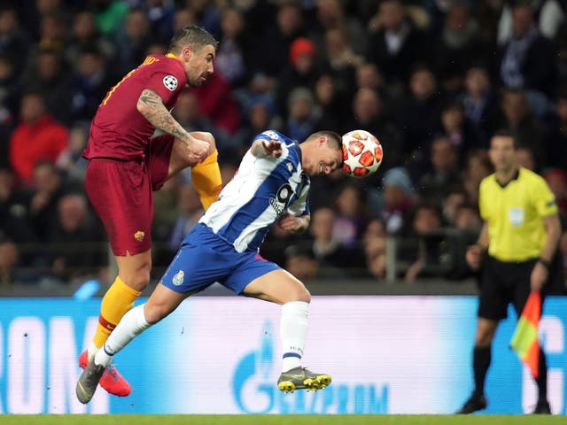 Aleksandar Kolarov vies for the ball with Porto midfielder Otavio Edmilson