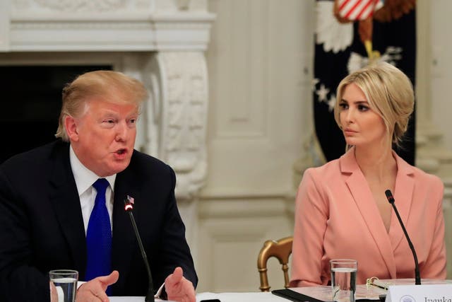 President Donald Trump, with American Workforce Policy Advisory Board co-chair Ivanka Trump, speaks to the advisory board's first meeting in the State Dining Room of the White House in Washington
