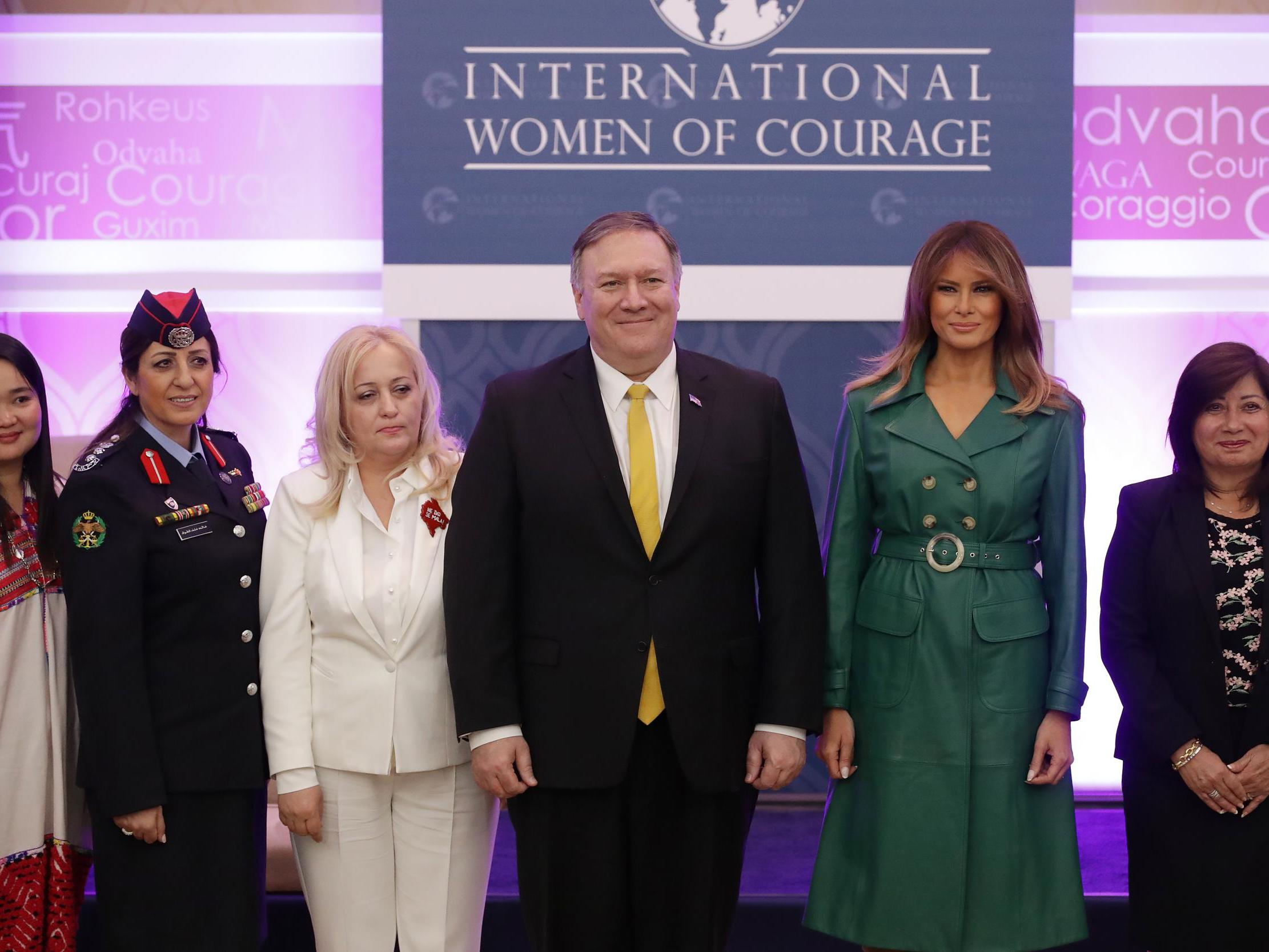 First lady Melania Trump and State Secretary Mike Pompeo pose alongside International Women of Courage awardees at the Department of State's Harry S. Truman building March 07, 2019.