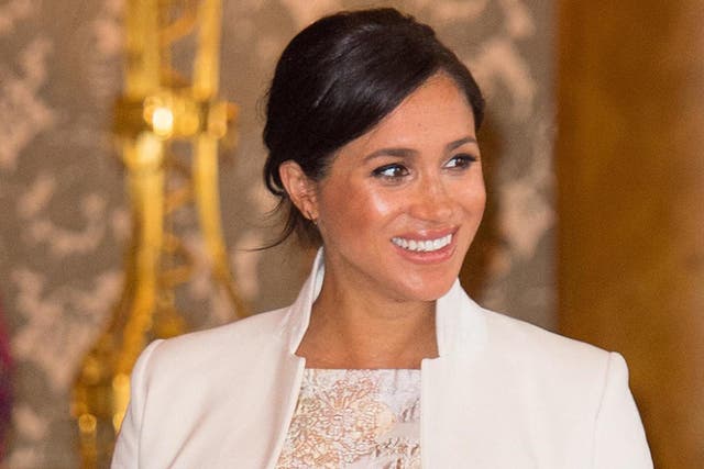 Duchess of Sussex attends a reception to mark the fiftieth anniversary of the investiture of the Prince of Wales at Buckingham Palace on 5 March 2019 in London