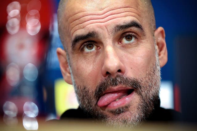 Manchester City's head coach Pep Guardiola attends a press conference
