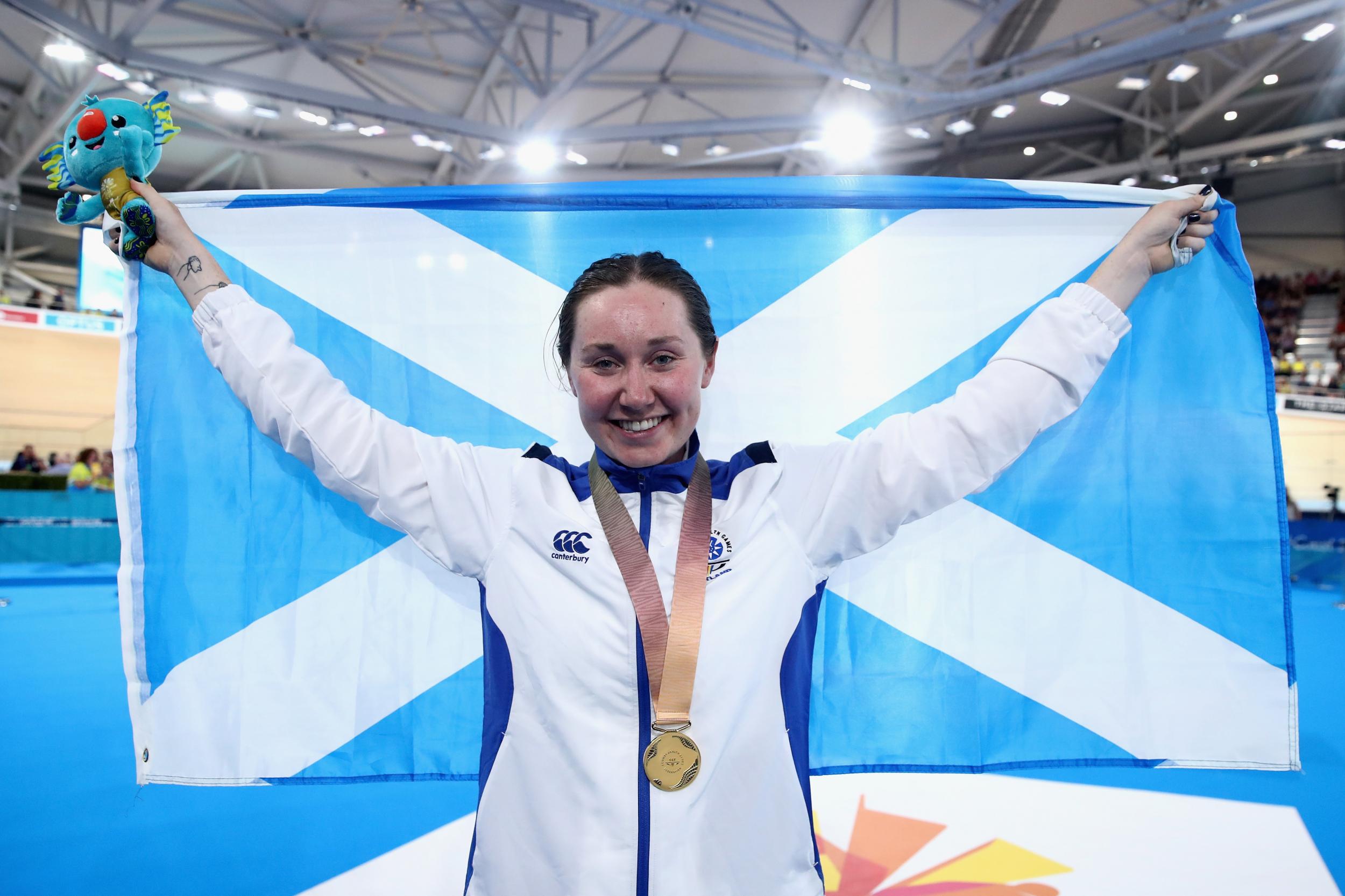 Katie Archibald celebrating her Commonwealth individual pursuit title