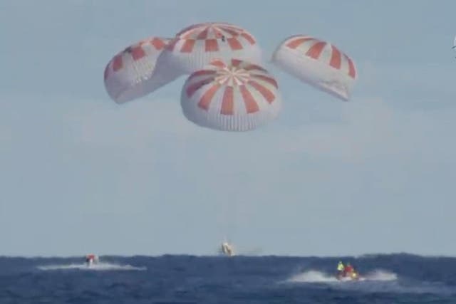 A grab taken from a NASA TV live feed shows SpaceX's Dragon capsule splash down in the Atlantic Ocean