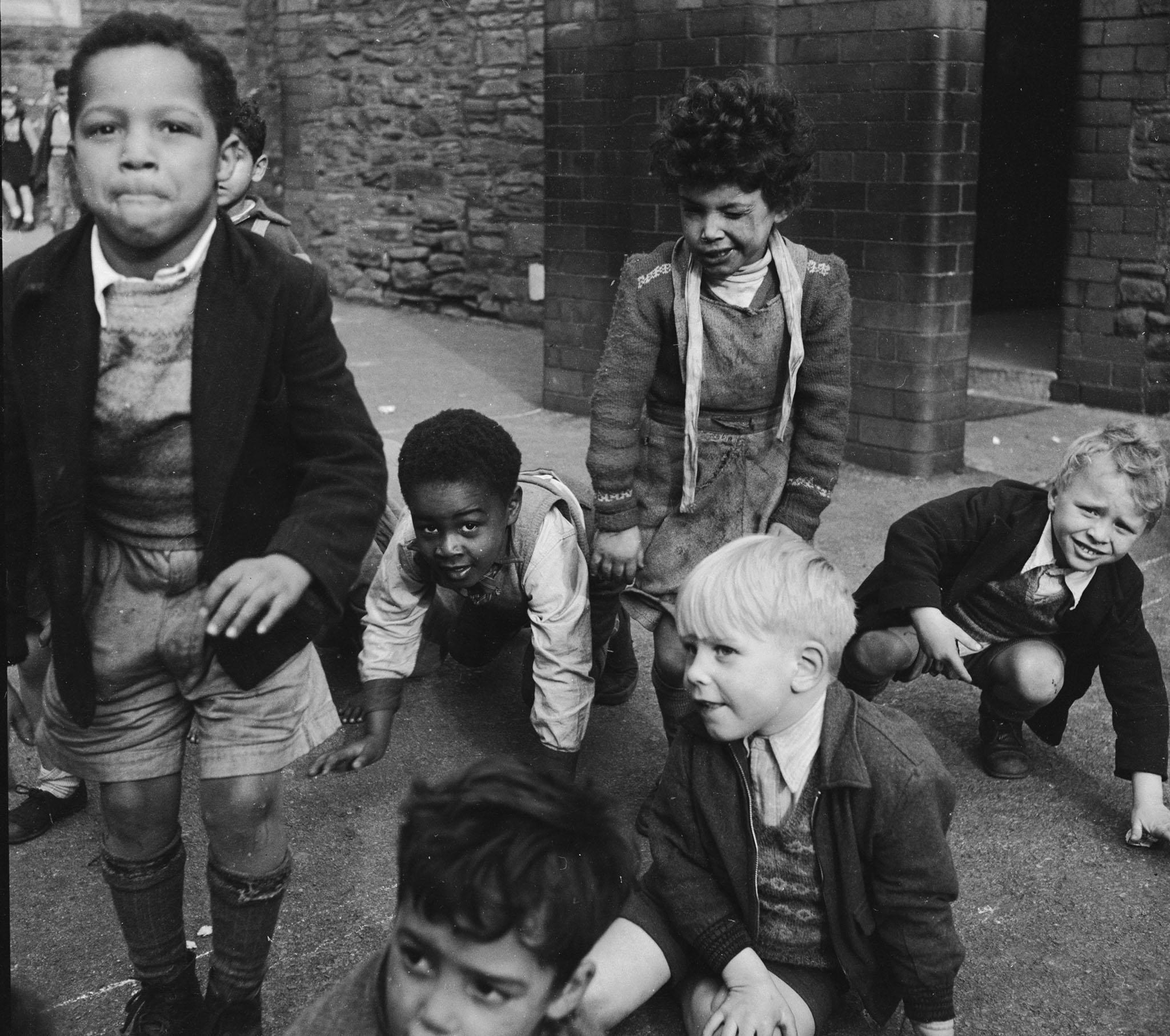 Children play together on the streets in 1955