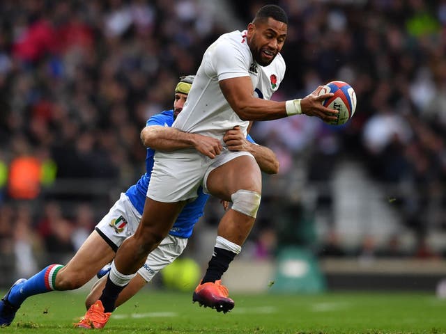 Italy's wing Angelo Esposito tackles England's wing Joe Cokanasiga