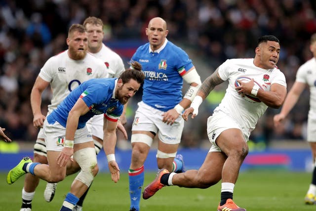 England's Manu Tuilagi on the way to scoring his side's third try
