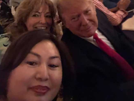 Li Yang takes a selfie with Donald Trump during Super Bowl party