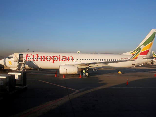 Workers service an Ethiopian Airlines Boeing 737-800 plane at Bole International Airport, Addis Ababa