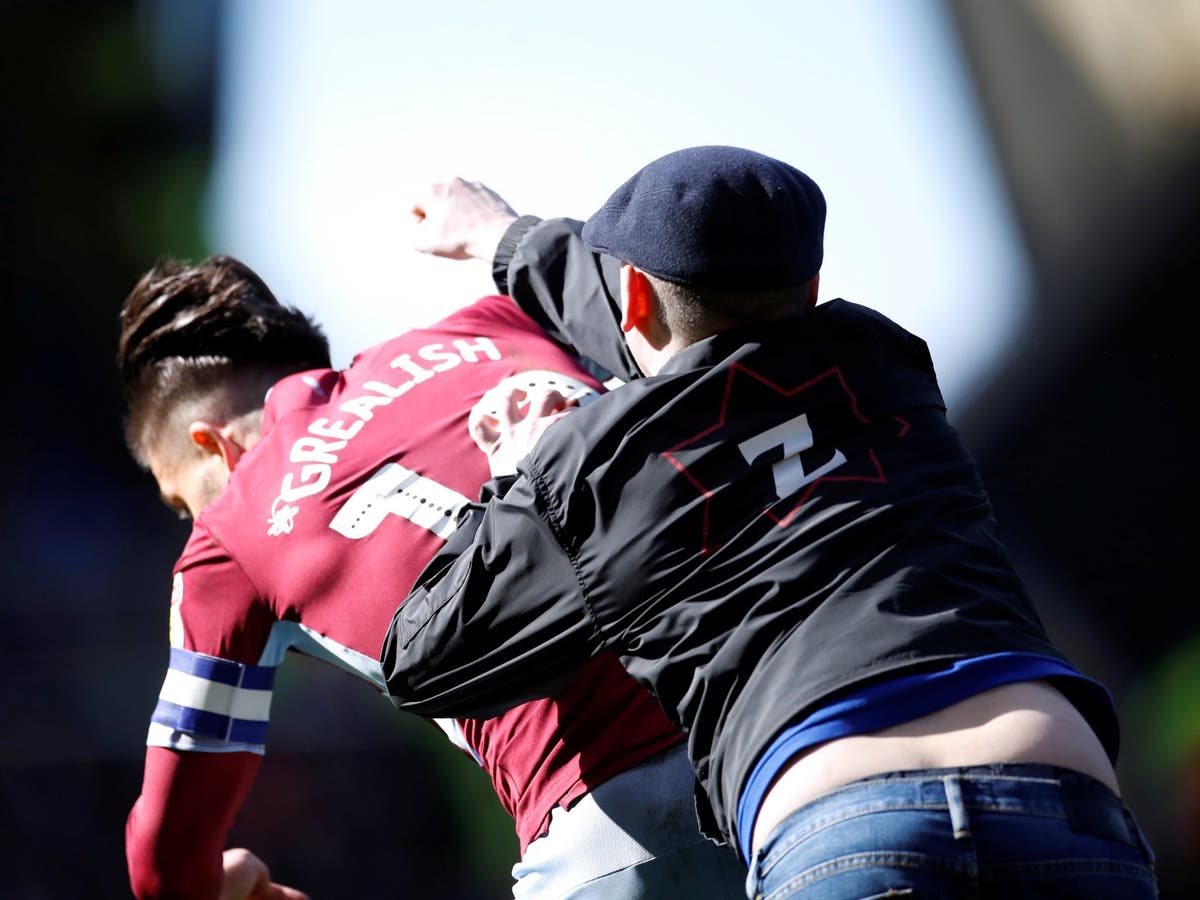 Jack Grealish punched: Aston Villa midfielder hit by fan on pitch during derby with Birmingham City