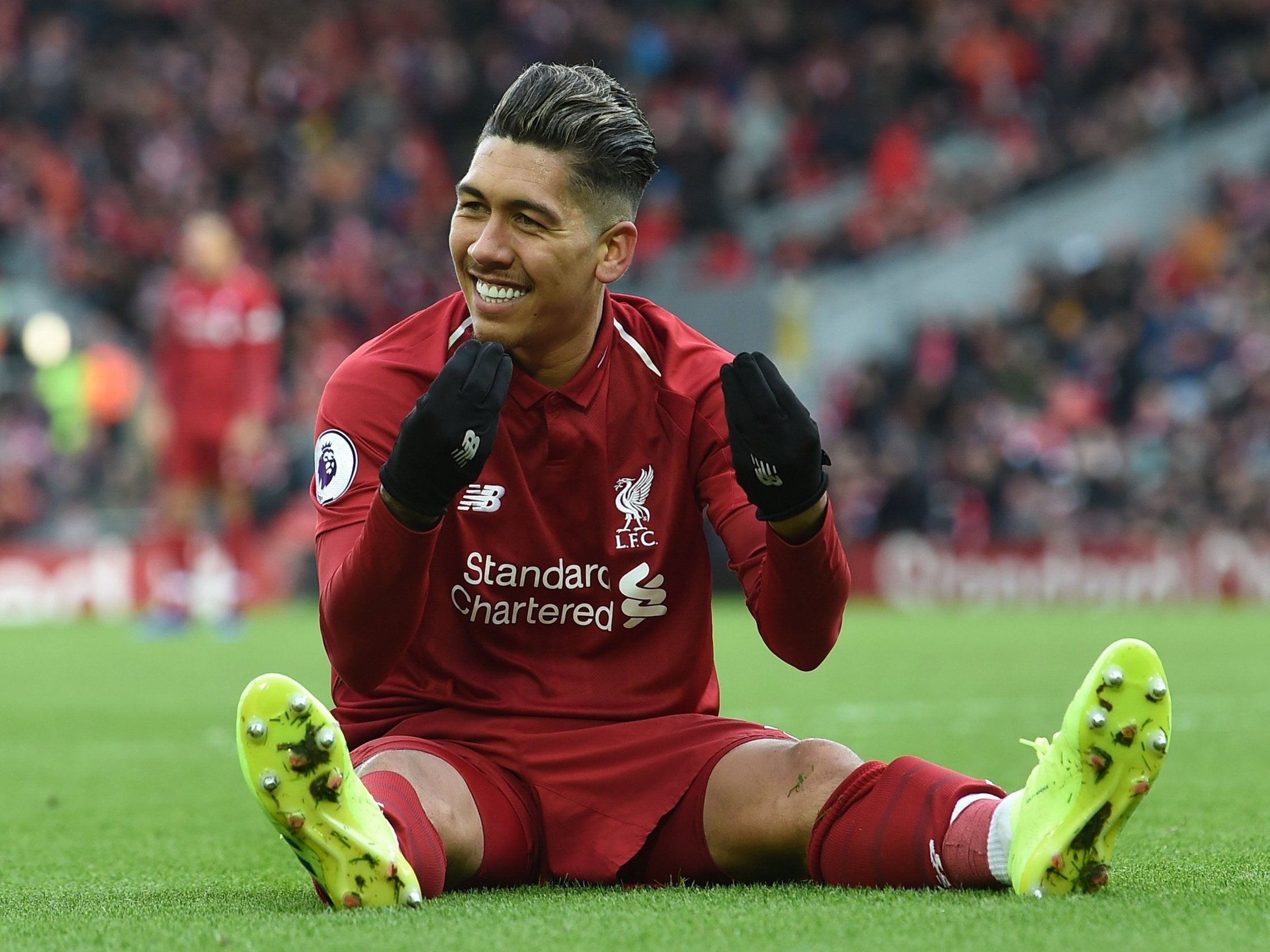 Roberto Firmino celebrates after scoring his second goal of the game for Liverpool against Burnley