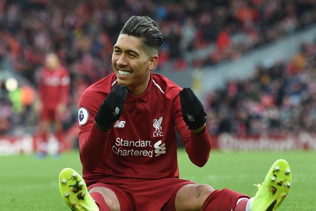 Roberto Firmino celebrates after scoring his second goal of the game for Liverpool against Burnley