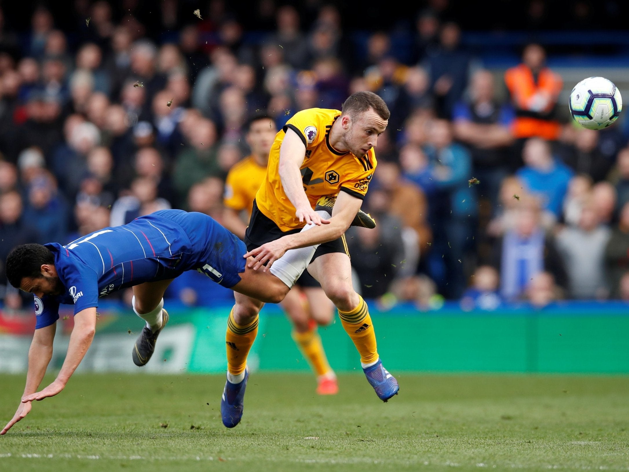 Wolverhampton Wanderers' Diogo Jota clashes with Chelsea's Pedro