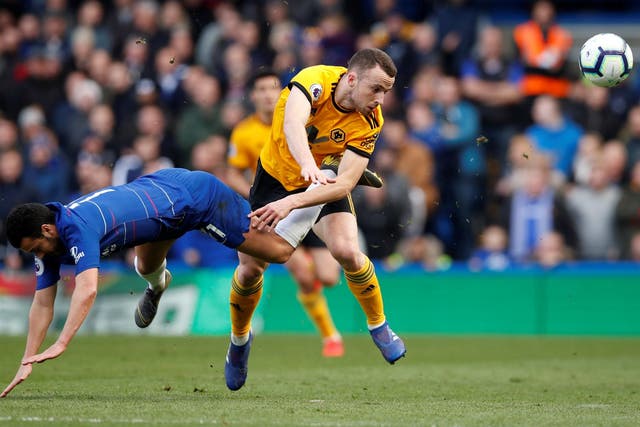 Wolverhampton Wanderers' Diogo Jota clashes with Chelsea's Pedro