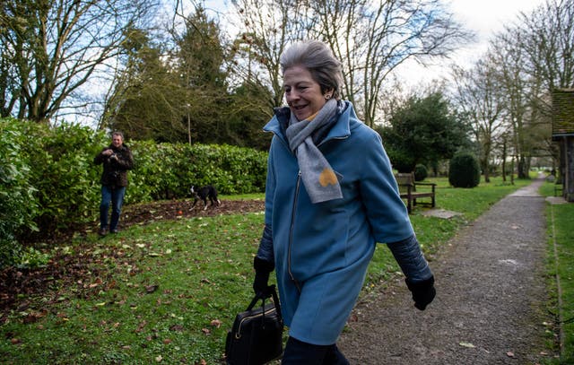 Theresa May and her husband Philip May leave after attending a church service on 10 March