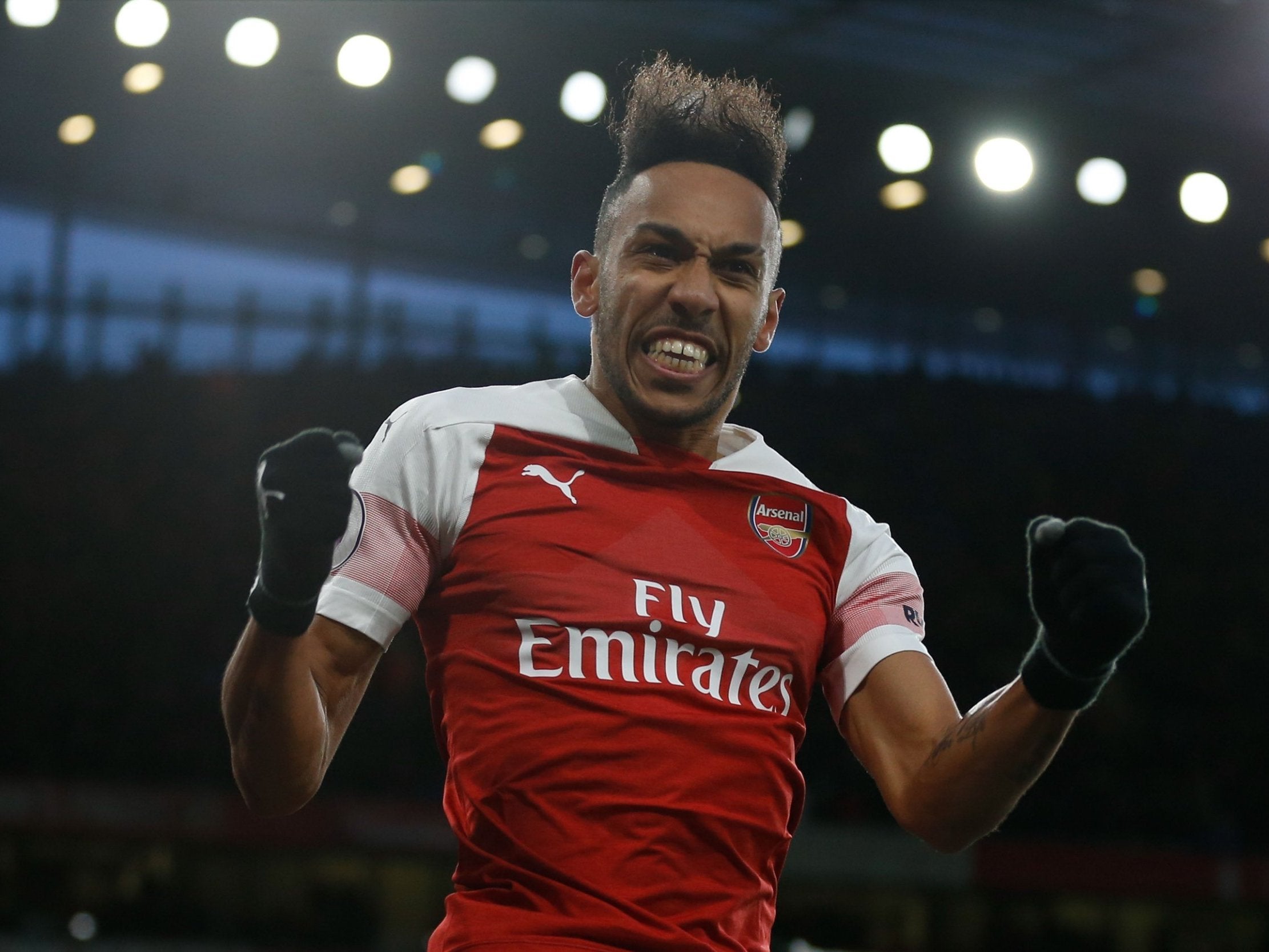 Pierre-Emerick Aubameyag celebrates putting Arsenal 2-0 ahead in their win over Manchester United (AFP/Getty )