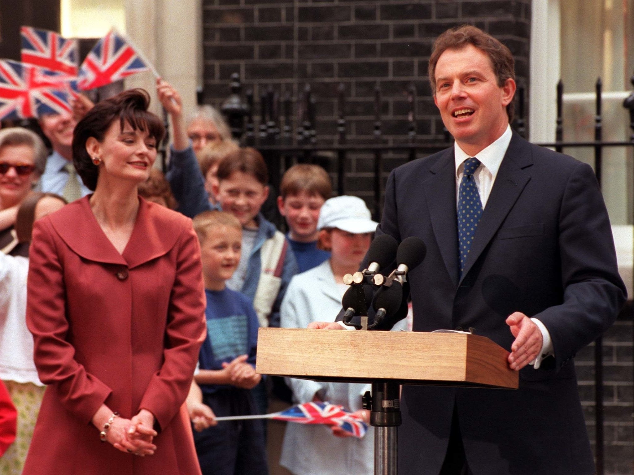 Cherie Blair looks on as her husband addresses the nation as prime minister in 1997