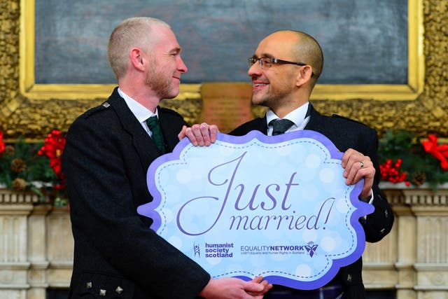 A couple wed in a humanist ceremony in Glasgow, conducted by Ross Wright, from the Humanist Society Scotland in 2014.