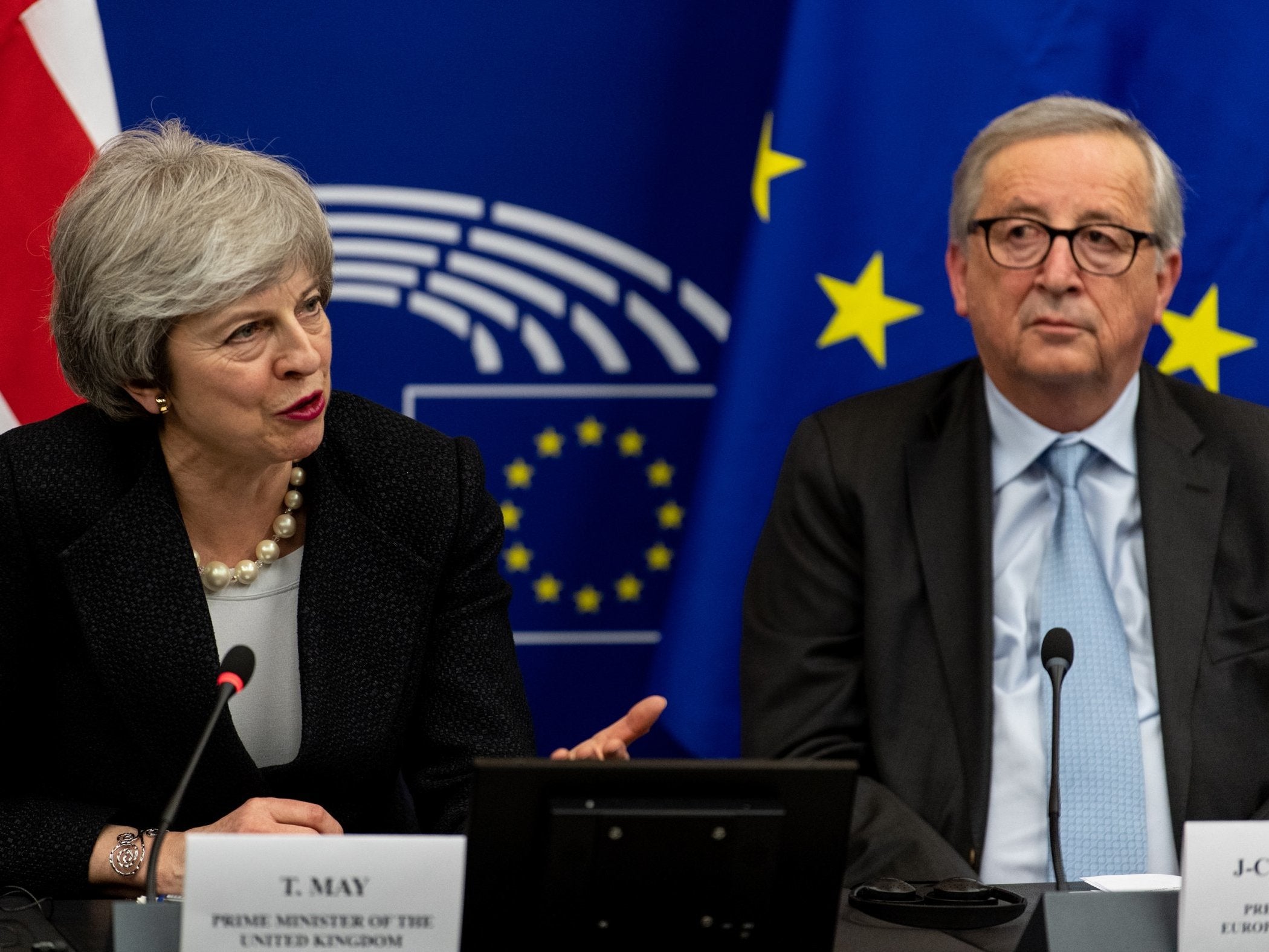 Theresa May and Jean-Claude Juncker speak to journalists during a press conference at the European Parliament in Strasbourg