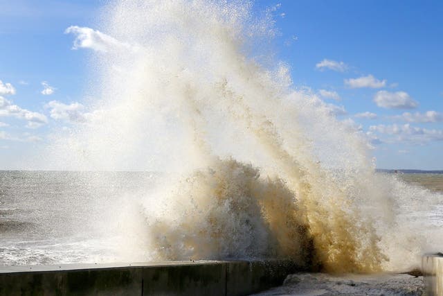 Waves crash against the sea defences in Camber, East Sussex, during strong winds ahead of Storm Gareth