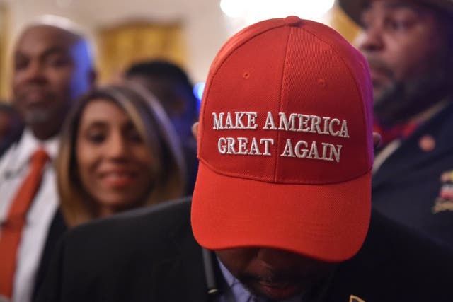 A man wearing a "Make American Great Again" (MAGA) cap.