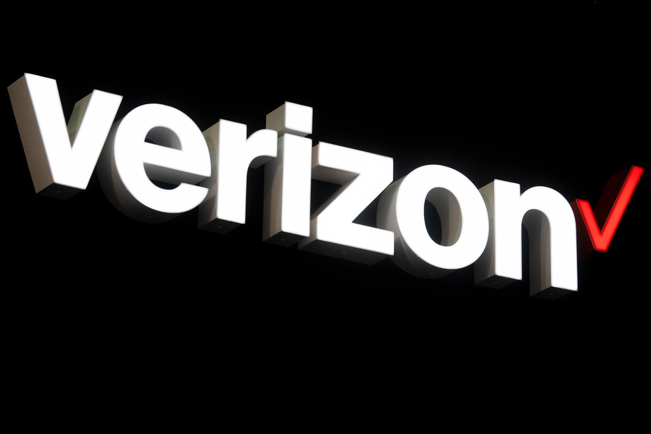 A logo sits illuminated outside the Verizon booth on day two of the GSMA Mobile World Congress 2019 on 26 February, 2019 in Barcelona, Spain.