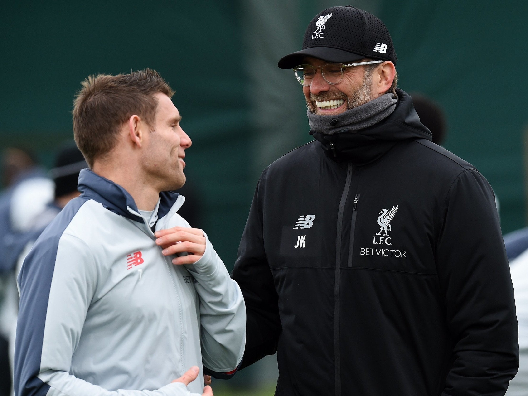 Jurgen Klopp in conversation with James Milner at Melwood this week
