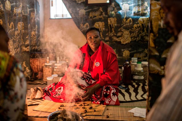 Traditional healer Gogo Phephisile Maseko attends to patients using a blend of cannabis and other herbs in Johannesburg