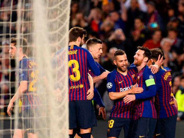 Lionel Messi celebrates with his teammates after scoring