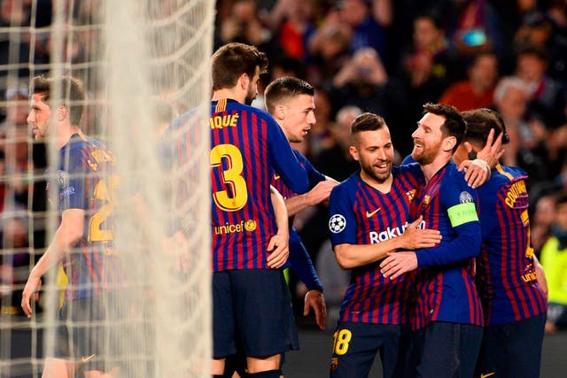 Lionel Messi celebrates with his teammates after scoring
