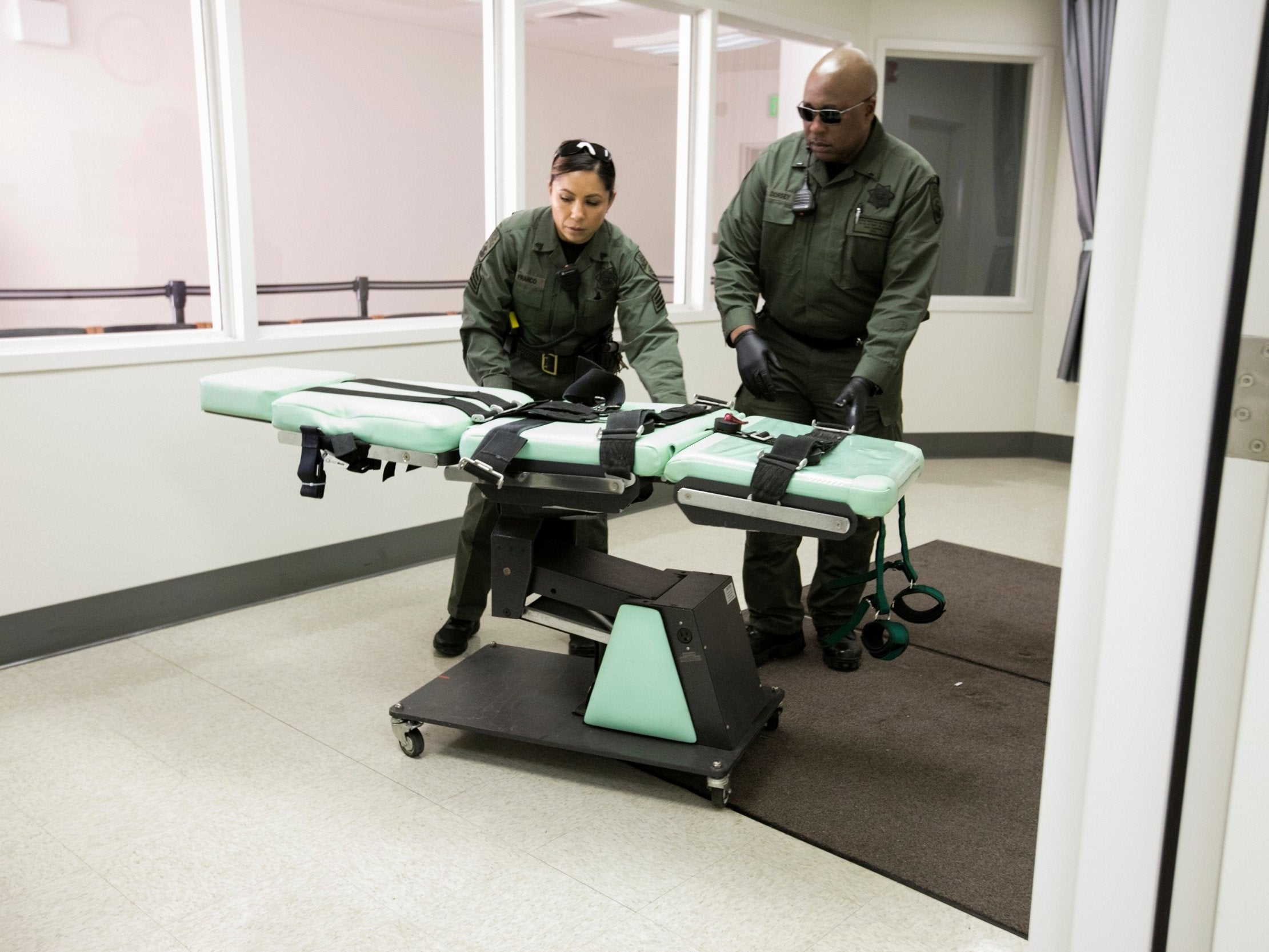 In this photo provided by the California Department of Corrections and Rehabilitation a gurney is removed from the death penalty chamber at San Quentin State Prison, Wednesday, March 13, 2019, in San Quentin, Calif.