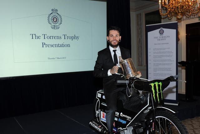 Woffinden poses with his award at the Pall Mall clubhouse in London