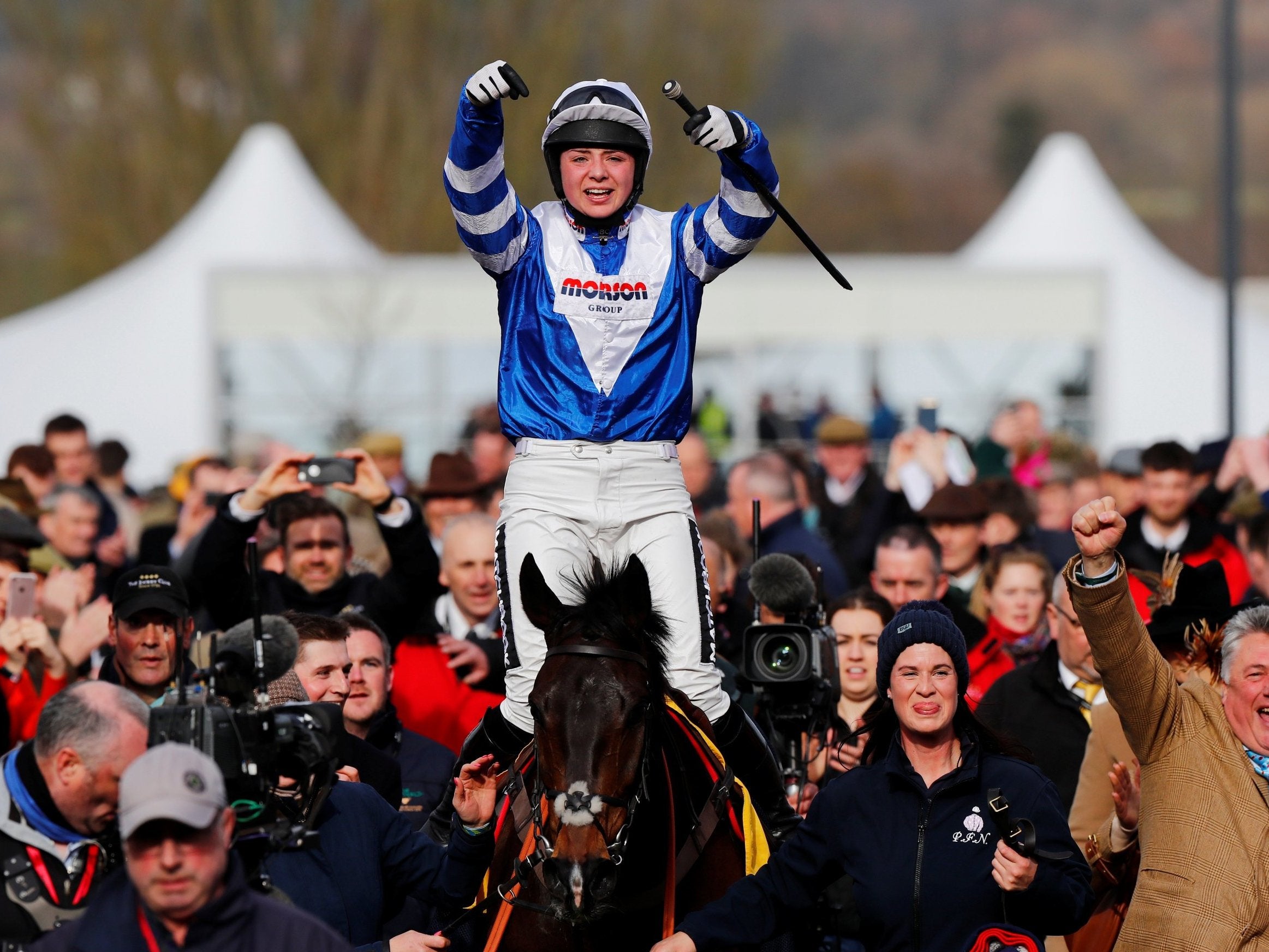 Bryony Frost celebrates winning the Ryanair Chase on the horse Frodon