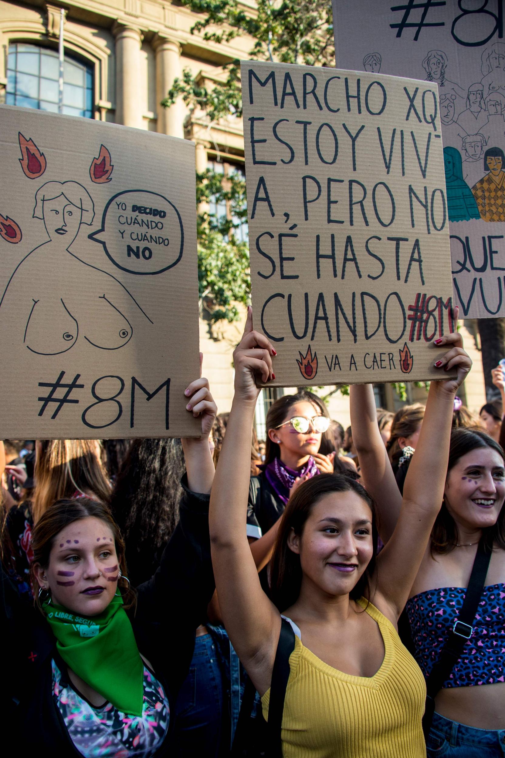 Women hold up placards with slogans while they took part in a march on the International Women’s Day in Santiago last week